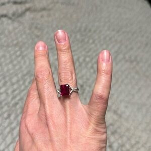 Sterling Silver ruby ring with accent cubic zirconia diamonds.